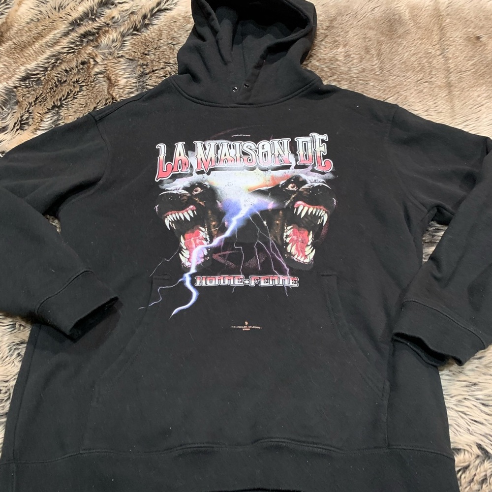 Homme + Femme
Black Hoodie La Maison De two guard dogs protecting the house.